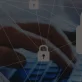 Representation of encrypted information in a security system, there's hands in the background typing